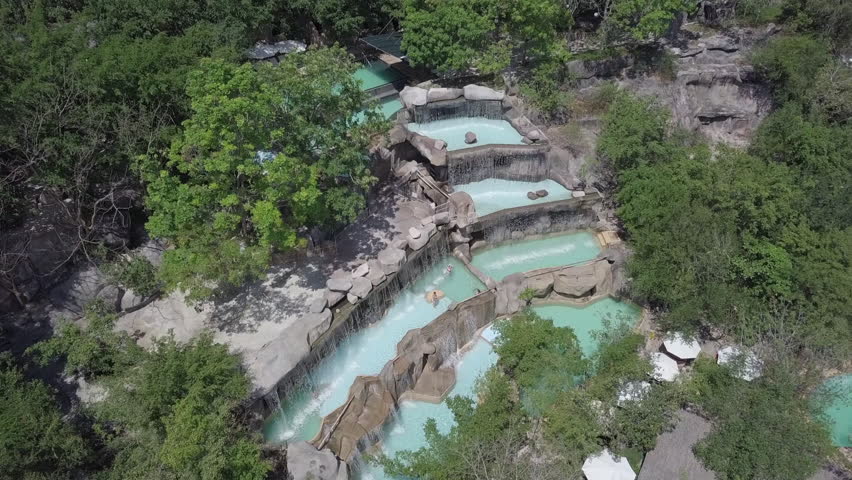 2K Aerial view of thermal waterfalls at I-Resort, Nha Trang Vietnam. Natural waterfalls among trees