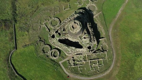 Video from above, aerial view of the ancient Santu Antine Nuraghe. Santu Antine Nuraghe is one of the largest nuraghi (ancient megalithic edifices) in Sardinia, Italy.