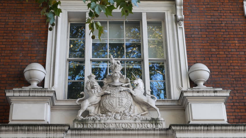 A window facade with The coat of arms of the United Kingdom.