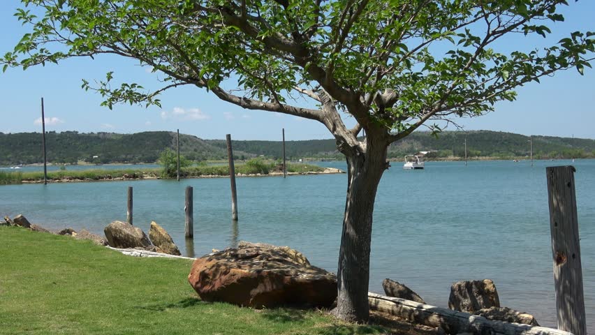 Beautiful landscape with Possum Kingdom Lake and boat.