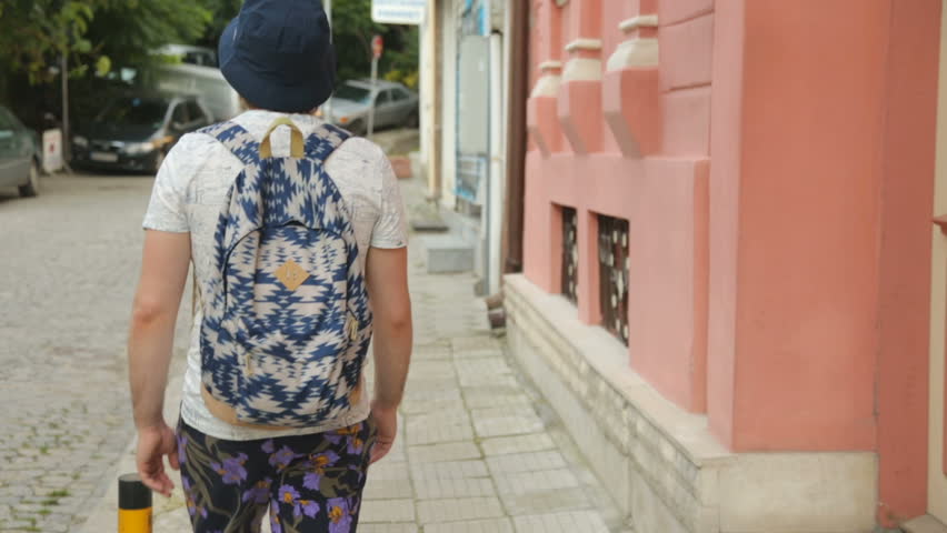 Tourist walking along the street