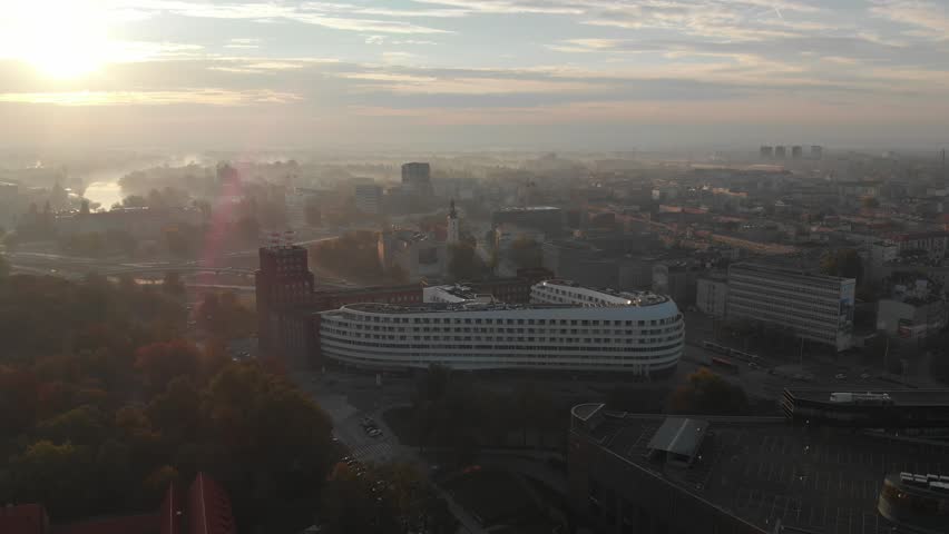Morning fog in city of Wroclaw, Poland, Europe. With a view of a church and Odra river.