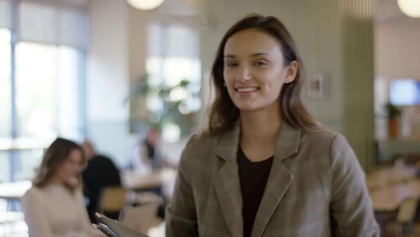 Portrait Of Happy Smiling Young Professional In Beautiful Creative Office Space