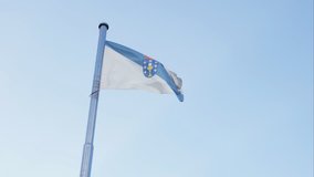 Flag of Galicia waving on the sky Spain 4K video