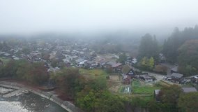 Aerial view of preserved ancient Shirakawa village with early morning fog, Gifu Prefecture, Japan