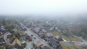 Aerial view of preserved ancient Shirakawa village with early morning fog, Gifu Prefecture, Japan