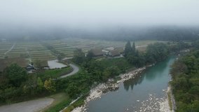Aerial view of the preserved ancient Shirakawa village with early morning fog, Gifu Prefecture, Japan.