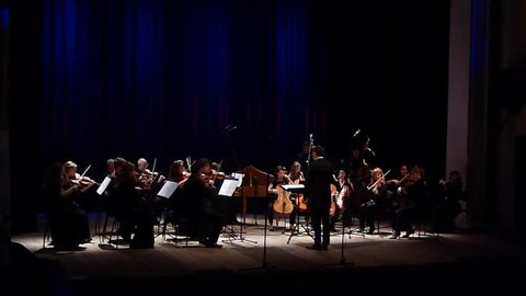 DNIPRO, UKRAINE - OCTOBER 22, 2018: Members of the FOUR SEASONS Chamber Orchestra - main conductor Dmitry Logvin perform  music by Carl Philipp Emanuel Bach at the State Drama Theatre.