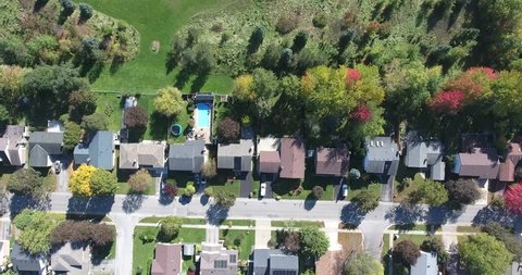 Flying Over Houses Into Park Aerial