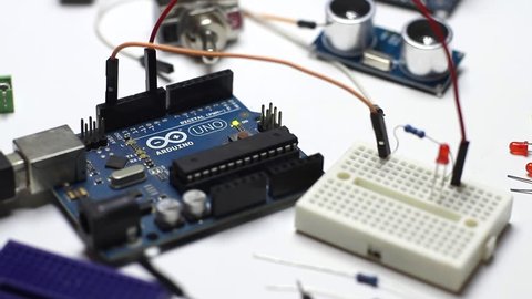 BUENOS AIRES - 28th October 2018: Arduino Uno in a DIY project. Blinking LED and electronic components and sensors. 