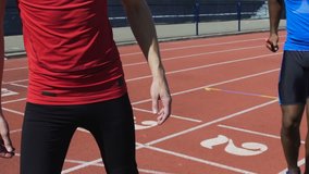 Hispanic athlete passing baton to his teammate, relay run, track and field - Powered by Shutterstock - Get 15% off with code: PIKWIZARD15