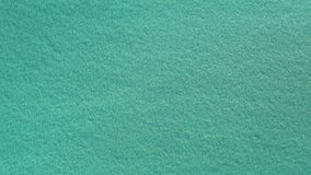 Video from above, aerial view of a clear and transparent sea. Sardinia, Italy.