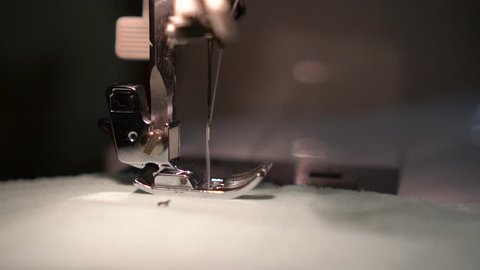 Sewing Presser Feet Slow Motion. Sewing Machine Close up
