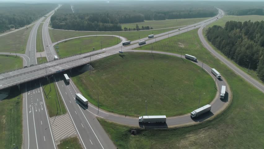 Convoy of trucks ride on the highway, technologies, artificial intelligence tracks trucks, motion graphics element from height. Royalty-Free Stock Footage #1018609291