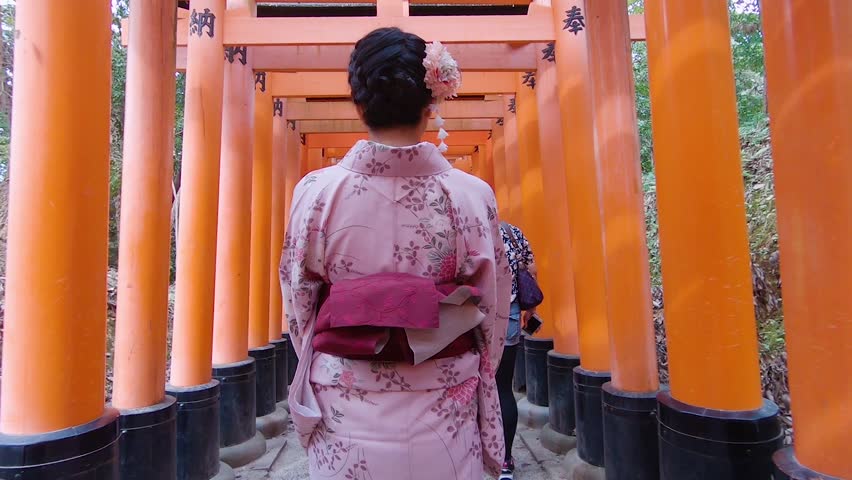 Women in traditional japanese kimono walking inside at Fushimi Inari Taisha in Kyoto, Japan. Royalty-Free Stock Footage #1018611127