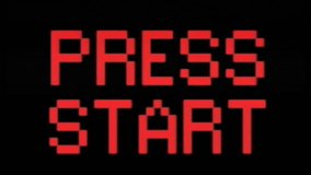 Analog VHS tape distortion: a flashing text with the words Press Start. Red on black, blocky 8-bit characters, faded color tone.
