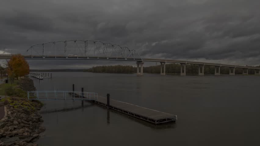 A Wide Angle Shot of the Wabasha-Nelson Truss Bridge Spanning the Mississippi River connecting Minnesota and Wisconsin during an Early Autumn Morning 4K Timelapse