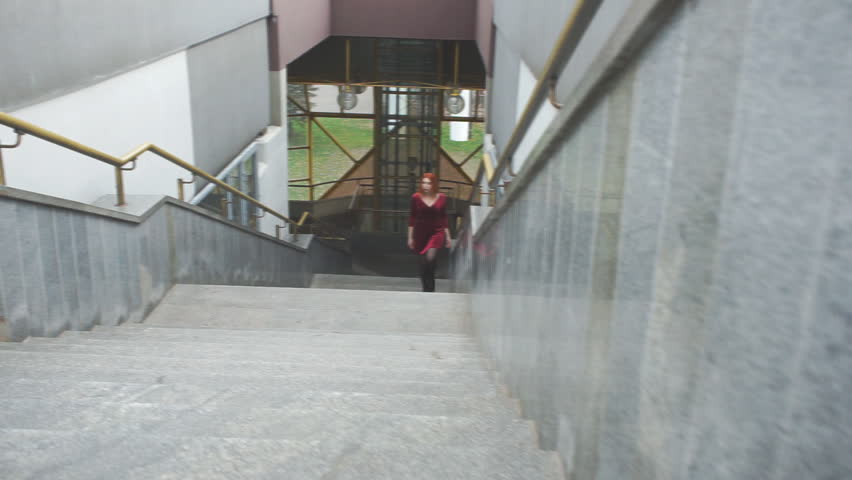 Young girl climbs the stairs