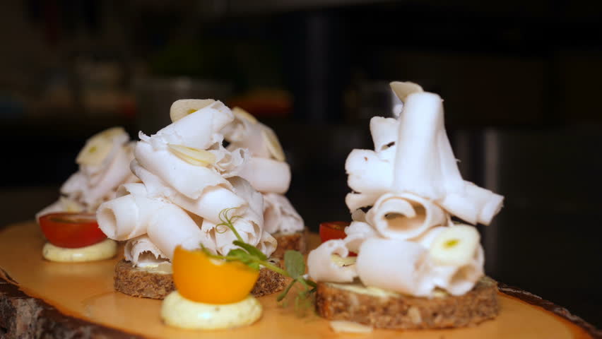 Ready dish lard and garlic, decorated with vegetables and greens, ready to serve at the table. Concept of: Dish of the day, Garlic, Restaurant, Traditional, lard, Home-made, Black bread, White bread. Royalty-Free Stock Footage #1018655938