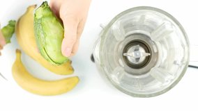Woman peeled an avocado for smoothies coctel preparation. 4K