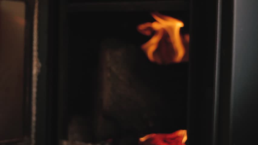 Lighting and having a cigarrette in fron of the fireplace