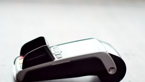 Person using contactless payment with smartphone. Mobile payment concept. Male using phone with NFC technology and POS terminal - Powered by Shutterstock - Get 15% off with code: PIKWIZARD15