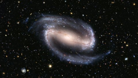 Beautiful spiral galaxy spinning among stars and slowly approaching