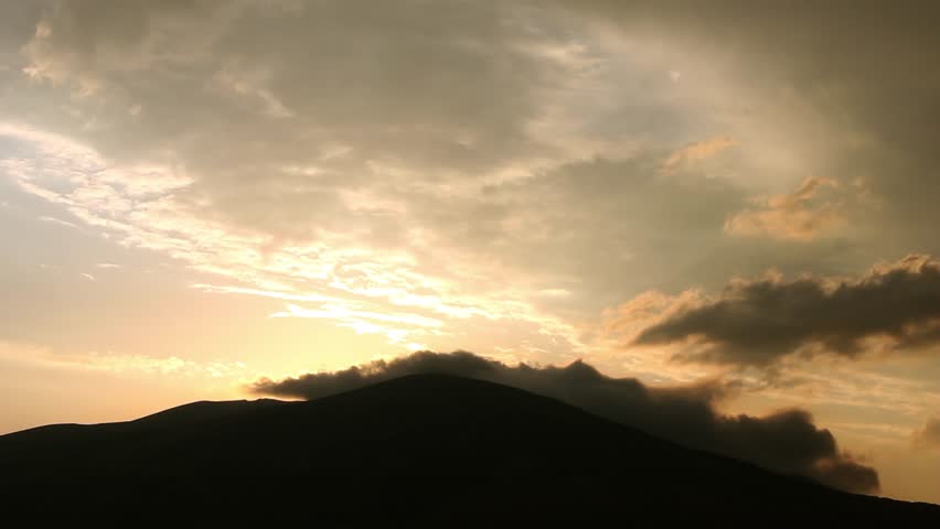 Nice orange burning clouds tim elapse in sunset time, beautiful colourful dark evening time, relaxing cloudscape fast motion.