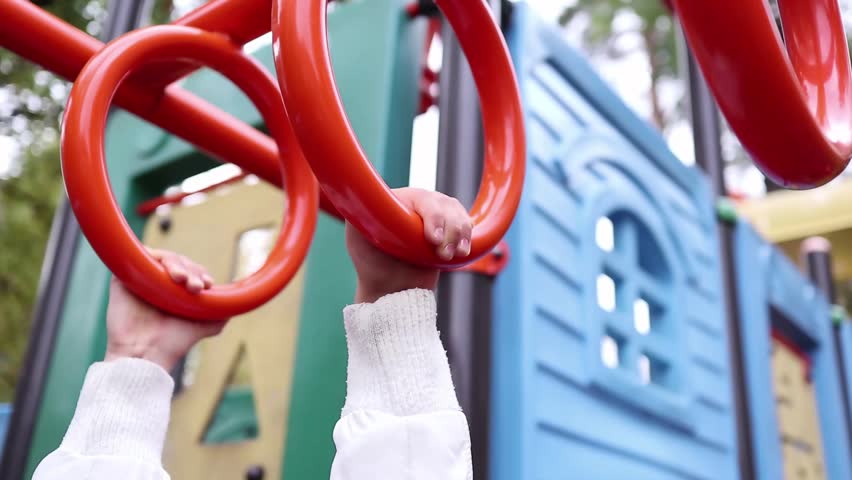 Hands going across monkey bars Royalty-Free Stock Footage #1018671157