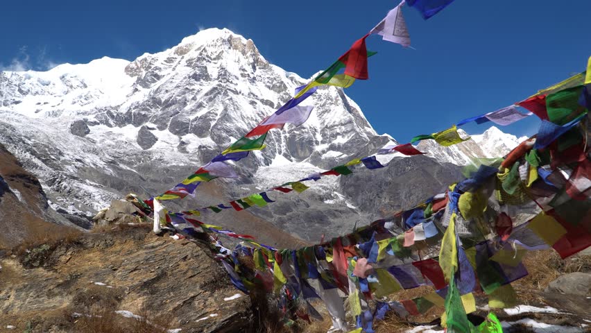 Annapurna I and prayer flags in Annapurna Base Camp, Nepal. Annapurna peak in the Himalaya range, Nepal. Annapurna base camp trek.