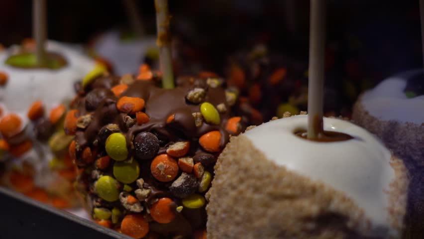 Toffee apples, also known as candy apples in North America, are whole apples covered in a hard toffee, chocolate and/or sugar candy coating with a stick inserted as a handle.