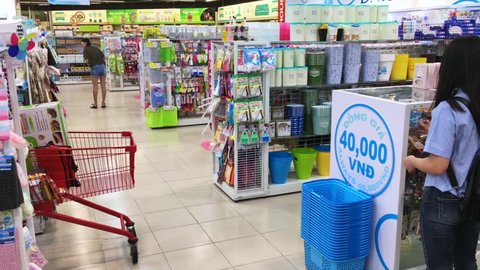 VUNG TAU, VIETNAM - NOVEMBER 7, 2017: People watch and choose goods at a Lottemart supermarket department with japanese goods at 2 dollars each.
