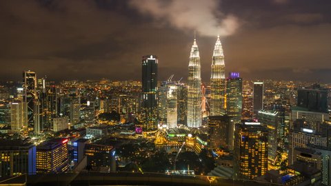 4k time lapse of night scene aerial view at Kuala Lumpur city skyline. slide left motion