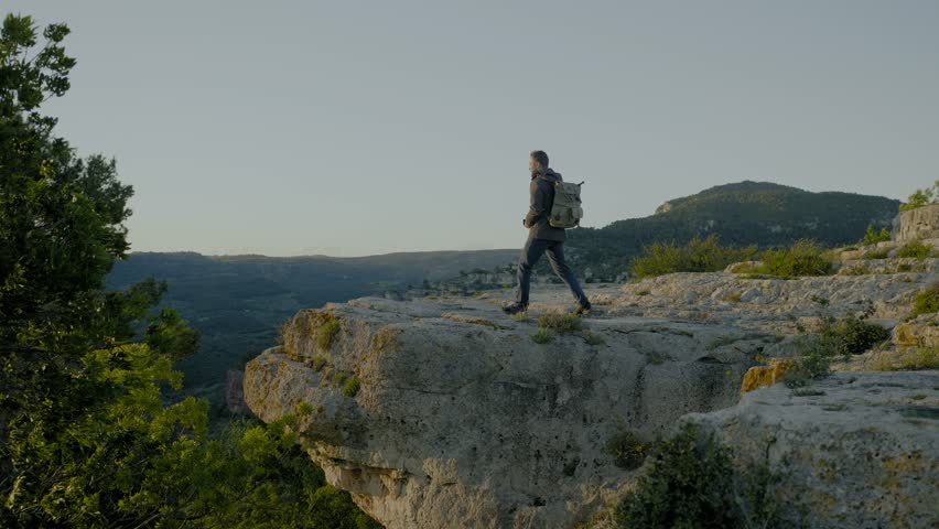 Photographer standing on top of mountain
