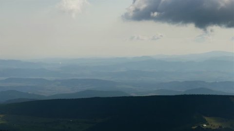 Hills and mountains in the distance viewed from Snezka, the highest mountain in Czech Republic