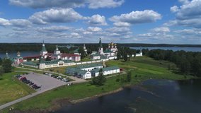 View of the Valdaisky Iversky Bogoroditsky Svyatoozersky monastery, June day (aerial video). Valdai, Russia  