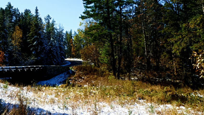 Car Drives Over First Highway Bridge over Mississippi River in Itasca State Park in Minnesota