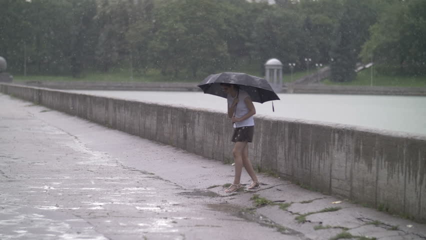 Greg enjoys in the rain walk walking