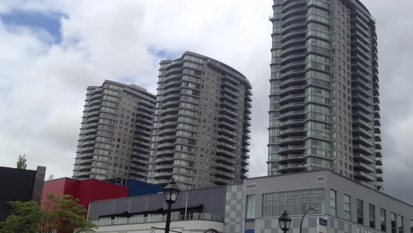 View of 3 huge residential building in New Westminster Canada from street level.