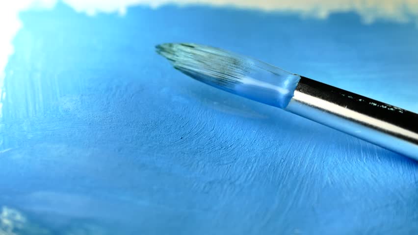 Pink and blue pastel color paint. Artistic brush dipped in a jar of liquid paint. Beautiful artwork with watercolor and acrylic. Brush smear on the picture and make the background.