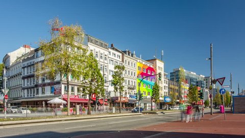 HAMBURG, GERMANY - OCTOBER 14, 2018: Day traffic at red-light district brothels and strip clubs at the Reeperbahn in Hamburg, Germany. Timelapse view.