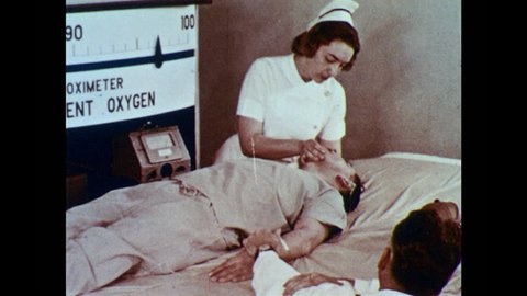 1950s: Needle moves on oximeter. Nurses gives mouth to mouth resuscitation to male patient. Man takes pulse. Men run into water to rescue drowning victim.