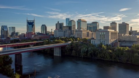 Tennessee Nashville Aerial Cityscape hyperlapse flying low over river and over downtown buildings 10/18