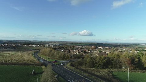 Aerial footage over the town of Whitburn in West Lothian, Scotland.