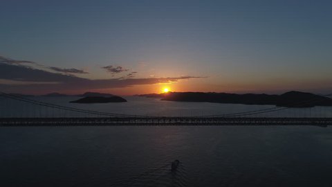 Aerial - Sunset and scenery of the Seto Inland Sea and the Seto Ohashi Bridge Zoom-out