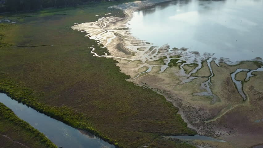 Aerial camera travels over intricate patterns etched in Bolinas Lagoon, near Stinson Beach, California