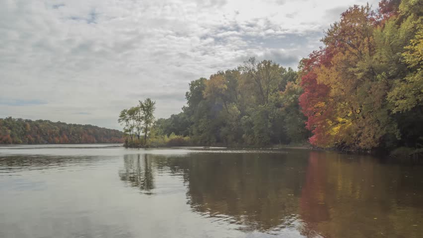 A Wide Angle Daytime Shot of Colorful Trees during Autumn along the Mississippi River in the Twin Cities, Minnesota 4K Timelapse