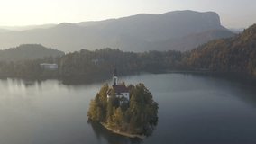 Aerial video. Flight over Lake Bled in Slovenia .Top View of the Church of the Assumption of the Virgin Mary