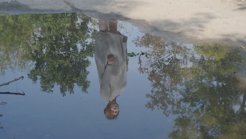 Reflection of a Girl in a Puddle
