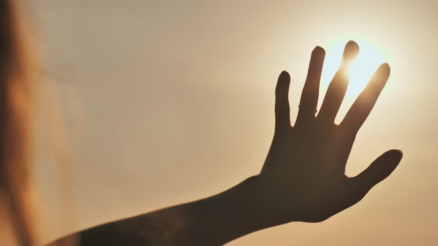 The girl touches the sunset sun the fingers. Romantic concept. | Shutterstock HD Video #1018800964